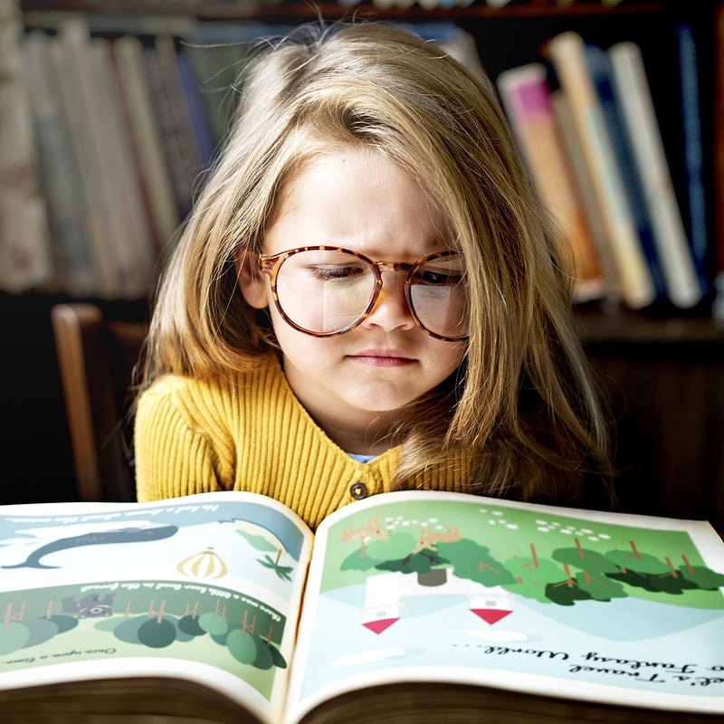 Little girl reading a story